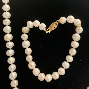 Genuine fresh water pearl necklace and bracelet.